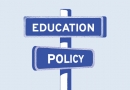 An illustration of street signs at an intersection that read "Education" and "Policy"