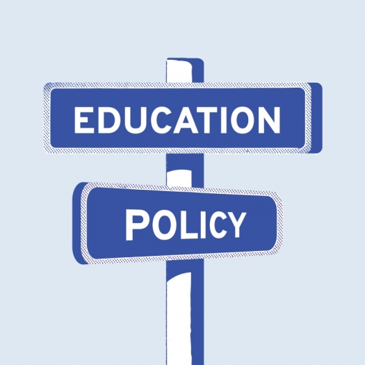 An illustration of street signs at an intersection that read "Education" and "Policy"